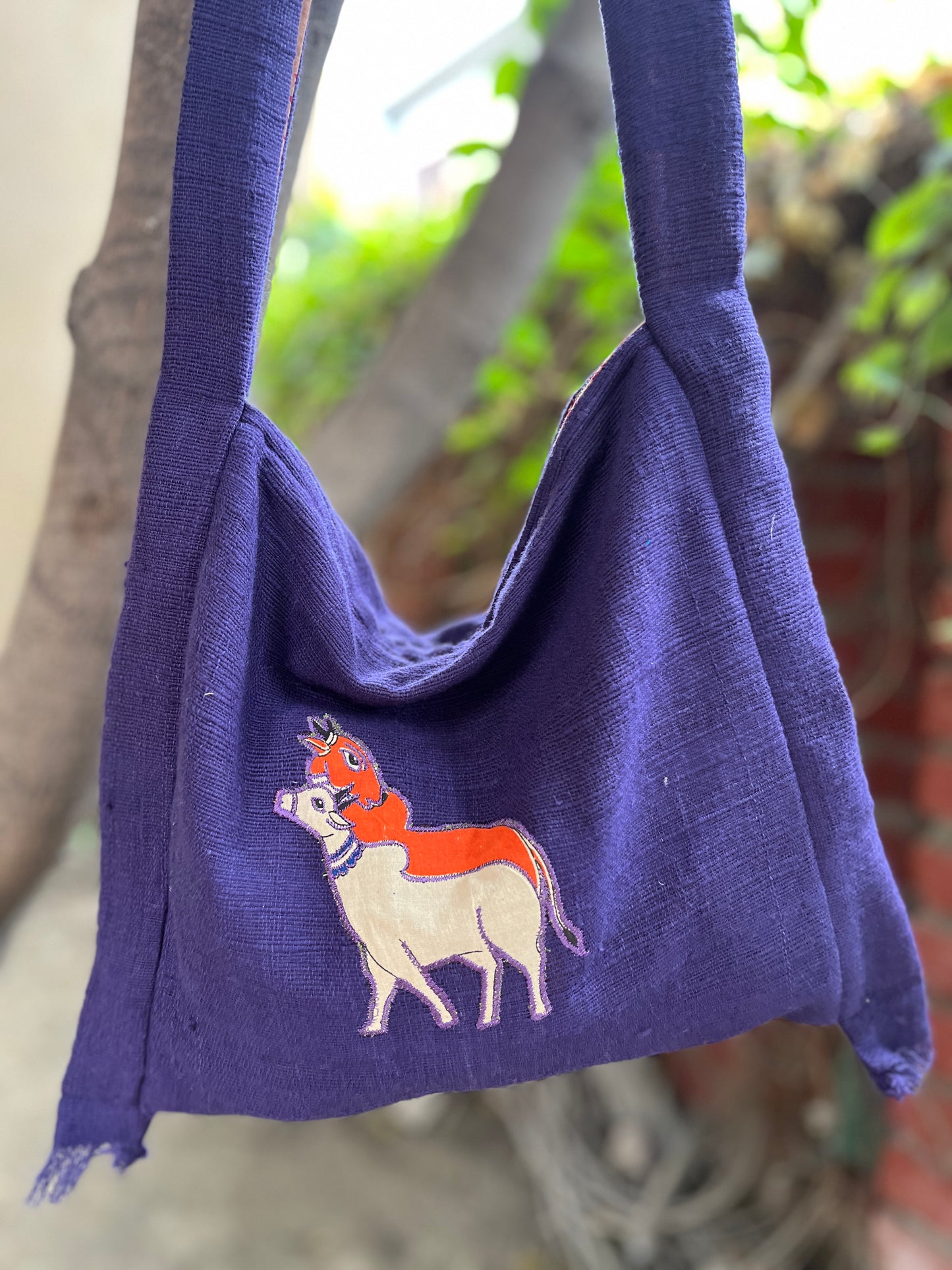 Handcrafted Purple Khadi Sling Bag with Folk Cow Motif Embroidery