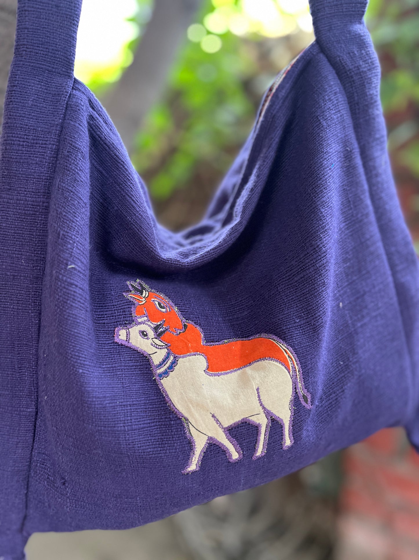 Handcrafted Purple Khadi Sling Bag with Folk Cow Motif Embroidery