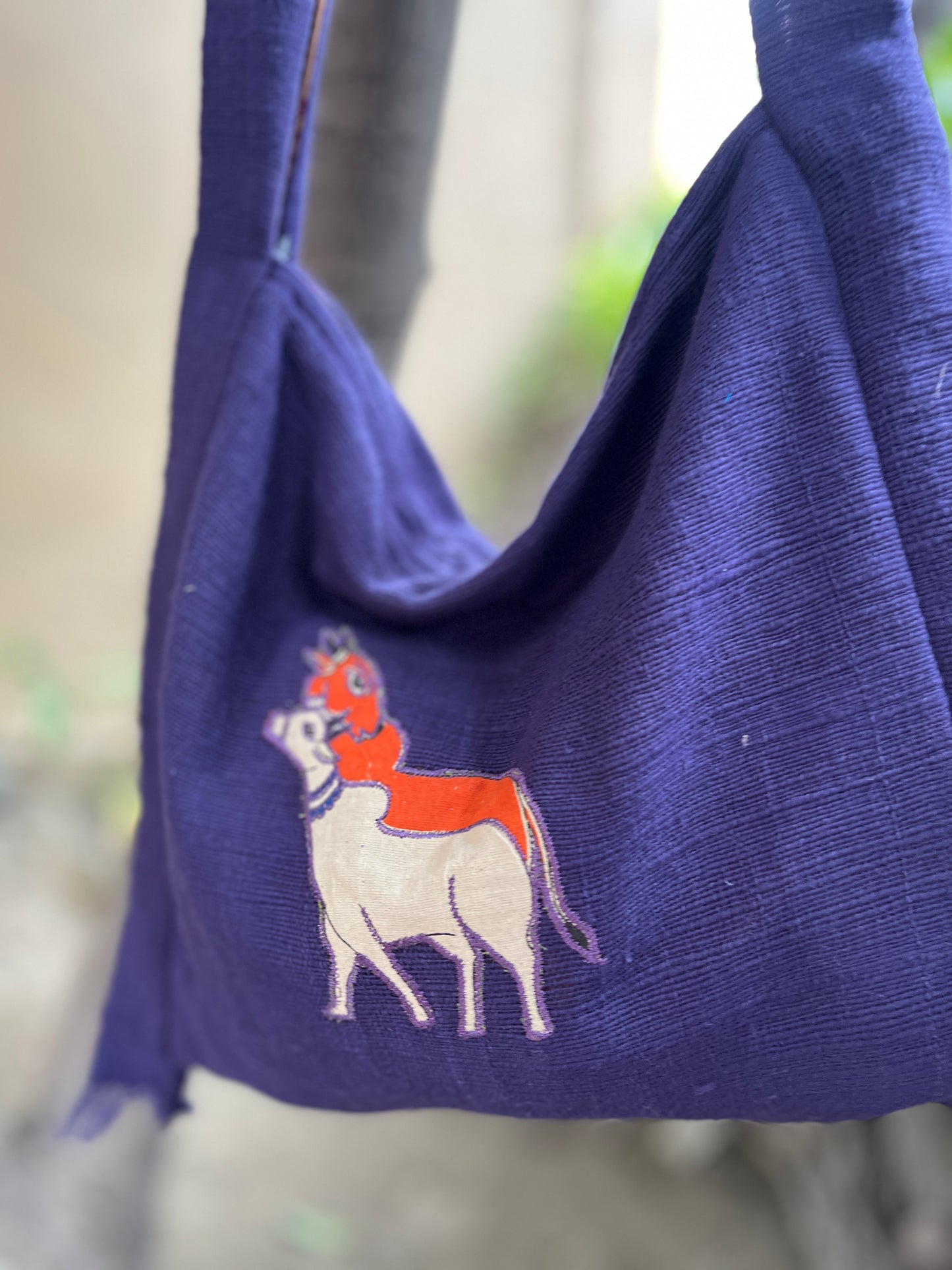Handcrafted Purple Khadi Sling Bag with Folk Cow Motif Embroidery